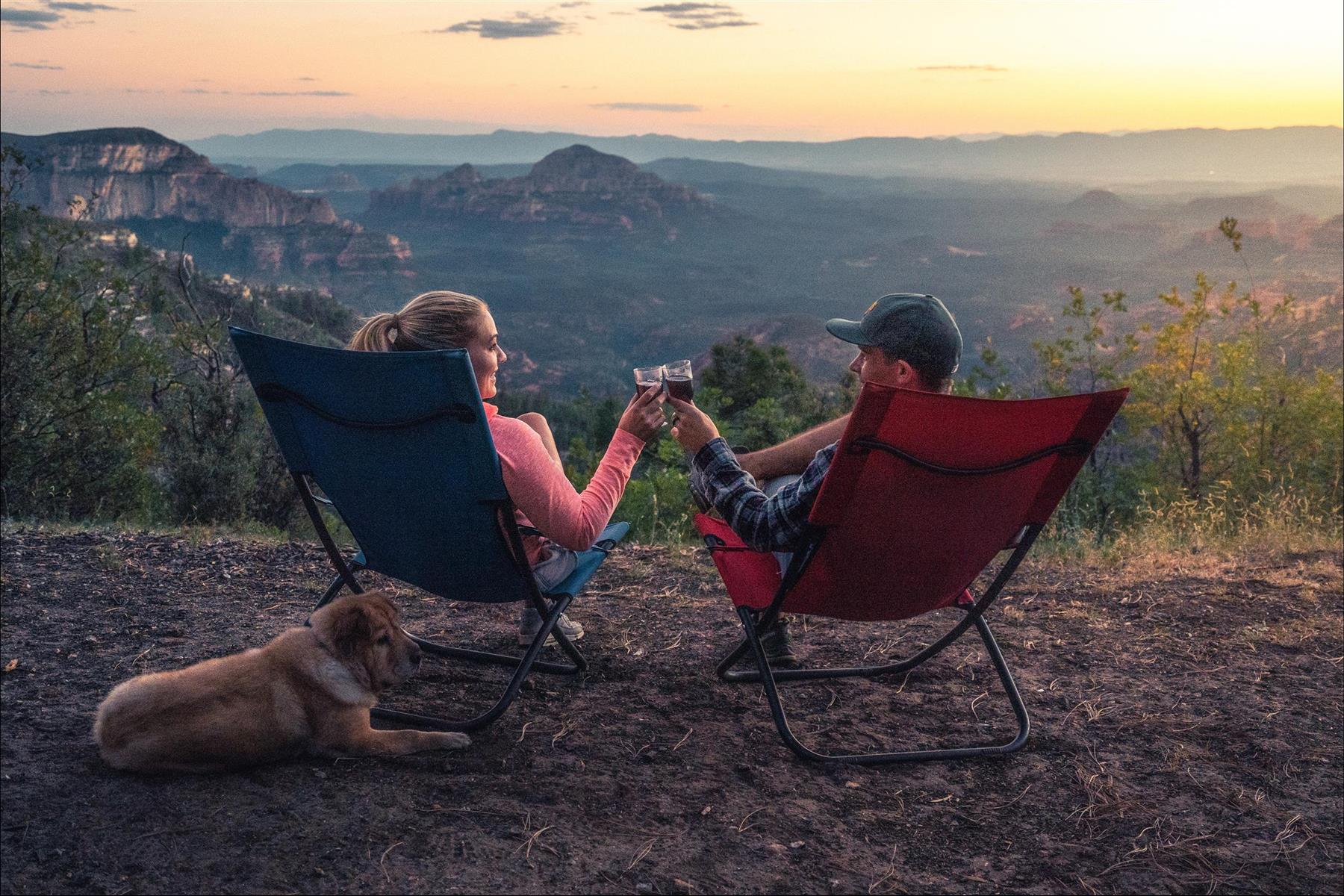 two people in camping chairs